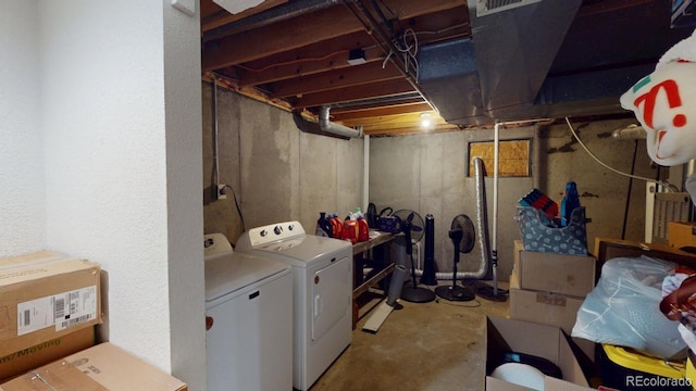 washroom with washer and dryer and laundry area