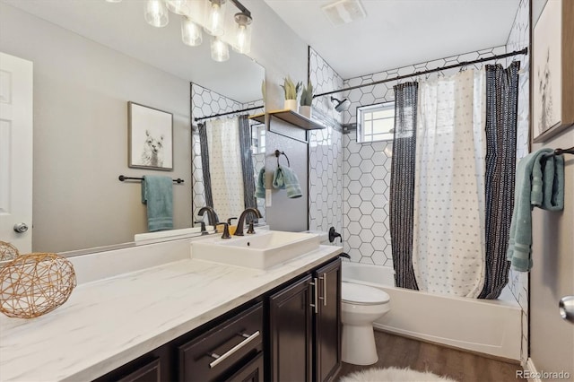 full bathroom with toilet, vanity, hardwood / wood-style flooring, and shower / tub combo with curtain