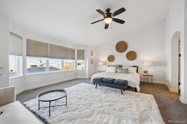 carpeted bedroom with ceiling fan and lofted ceiling