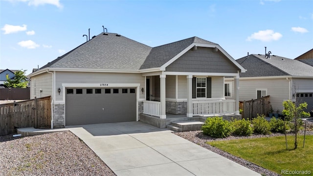 craftsman house with covered porch and a garage