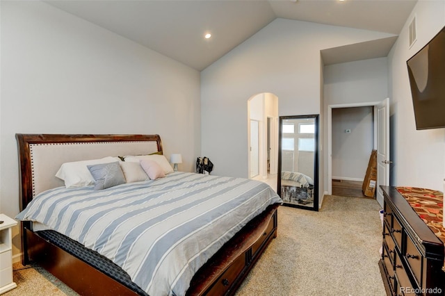 bedroom with recessed lighting, light colored carpet, and vaulted ceiling
