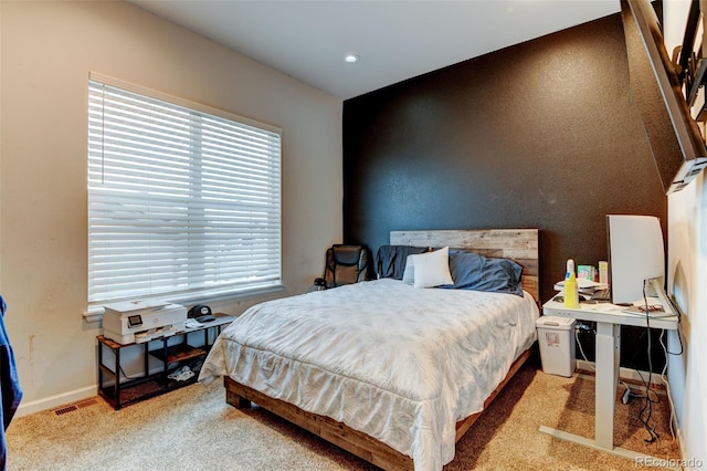 bedroom with visible vents and baseboards