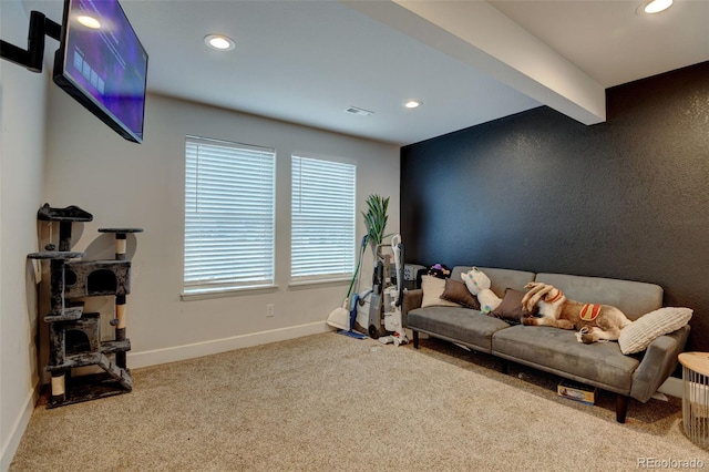 carpeted living area featuring beamed ceiling, baseboards, visible vents, and recessed lighting