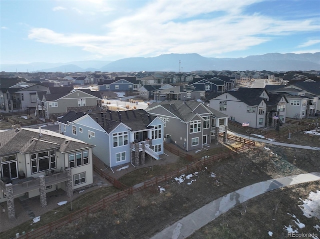 drone / aerial view featuring a residential view and a mountain view