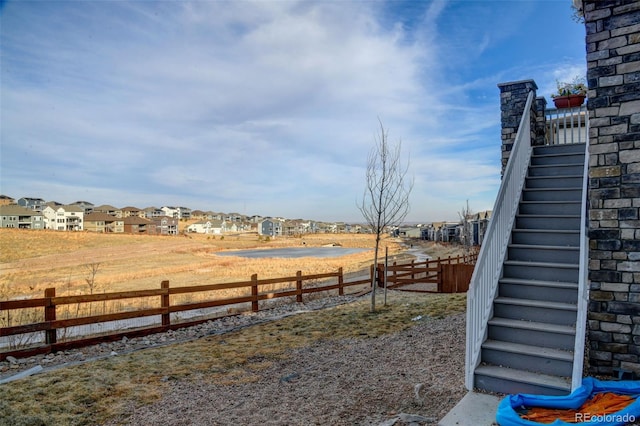 view of yard with a residential view and fence