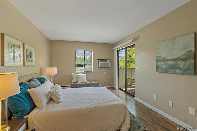 bedroom with wood finished floors, baseboards, a wall mounted AC, access to exterior, and a baseboard heating unit