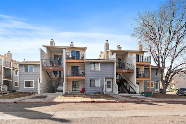 view of property featuring stairs