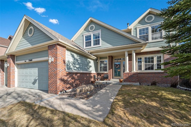 view of front of house featuring an attached garage, brick siding, and driveway