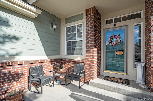 entrance to property with brick siding