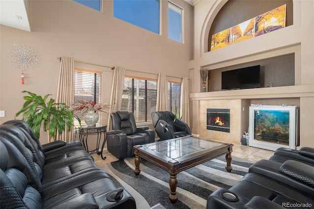 living room featuring a tile fireplace