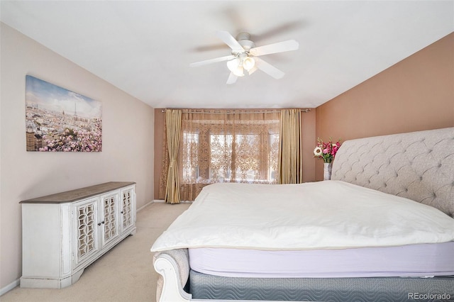 bedroom with baseboards, light carpet, and ceiling fan