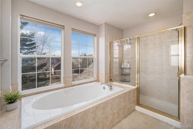 full bathroom with a bath, recessed lighting, and a shower stall