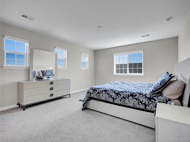 bedroom featuring carpet floors, baseboards, and visible vents