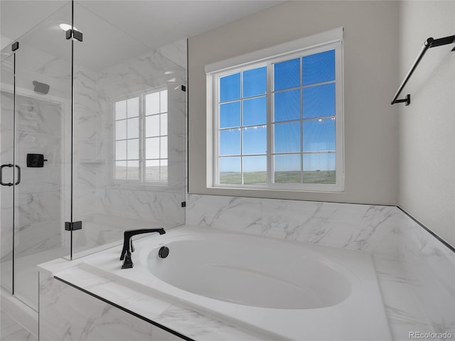 full bath featuring a marble finish shower and a garden tub