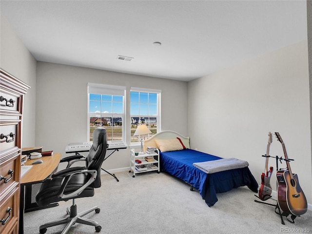 bedroom featuring visible vents, carpet, and baseboards