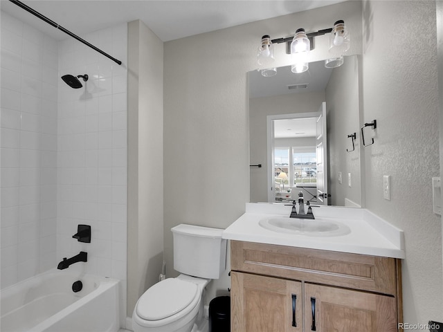 full bathroom featuring vanity, bathtub / shower combination, toilet, and visible vents