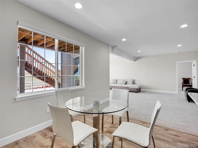 dining room with baseboards, recessed lighting, and wood finished floors