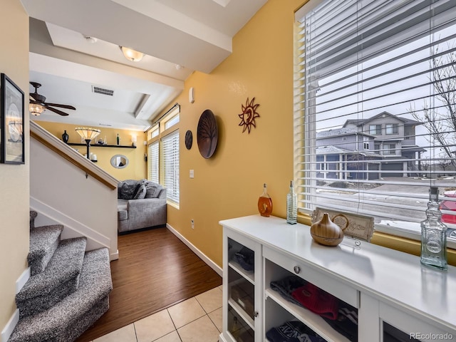 interior space featuring ceiling fan and tile patterned floors