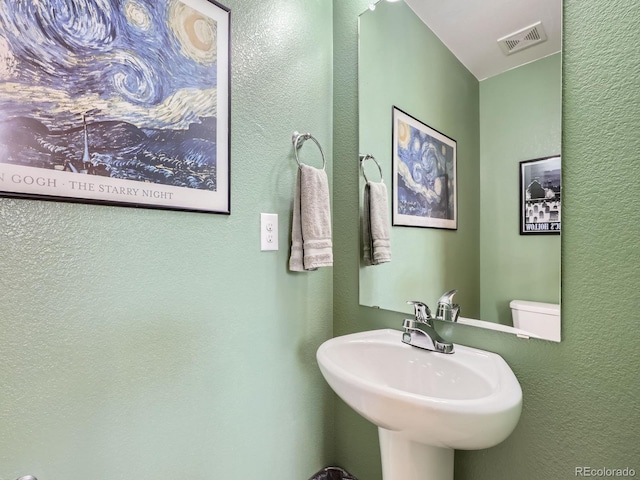 bathroom with sink and toilet