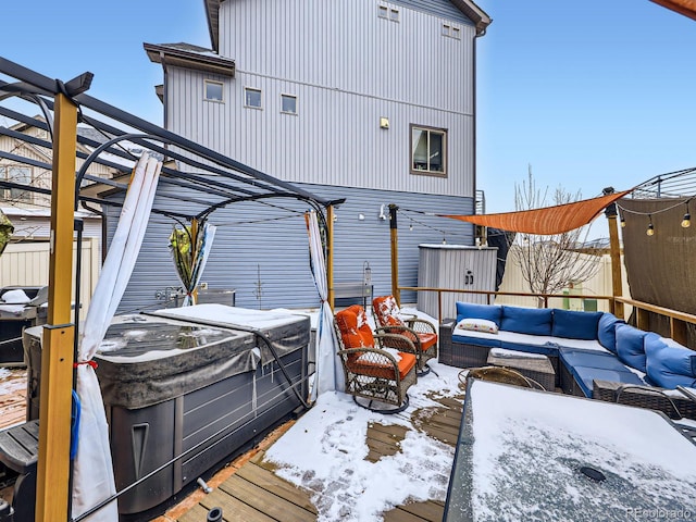 exterior space featuring an outdoor hangout area and a hot tub