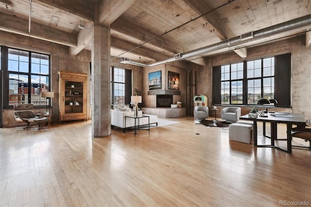 interior space featuring wood-type flooring, visible vents, and a healthy amount of sunlight