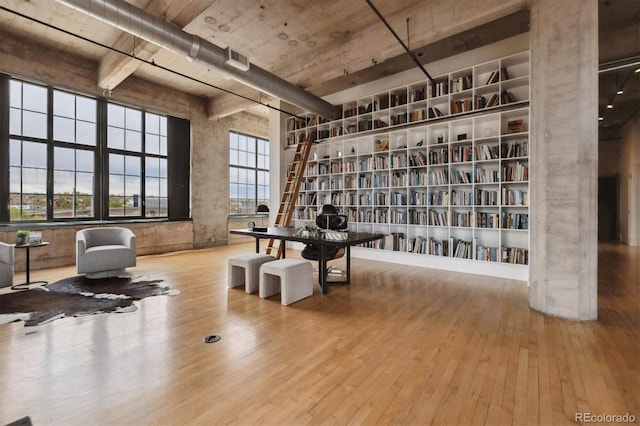 living area featuring visible vents and hardwood / wood-style flooring