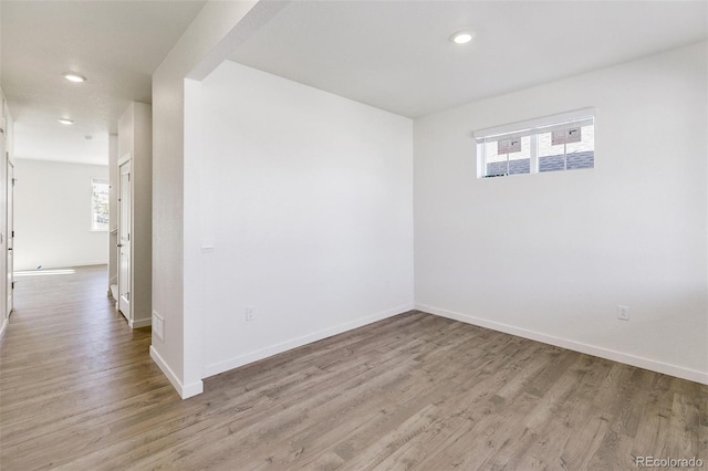 spare room with light wood-type flooring