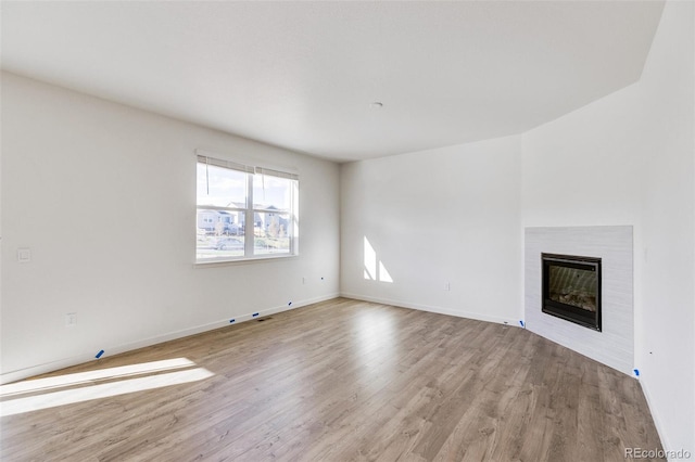 unfurnished living room with light wood-type flooring