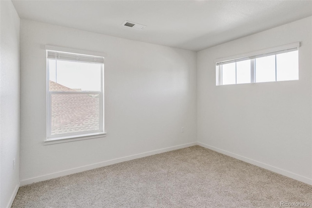 empty room featuring light colored carpet