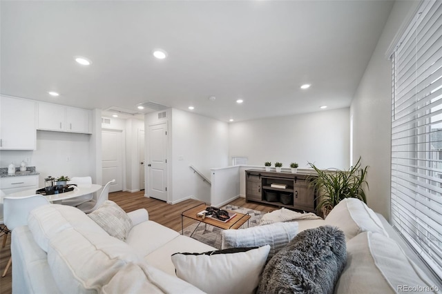 living room with light hardwood / wood-style flooring