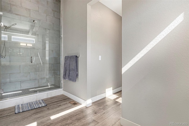 10179 E 59th N Pl, Denver, CO 80238 - bathroom with baseboards, wood finished floors, and a stall shower