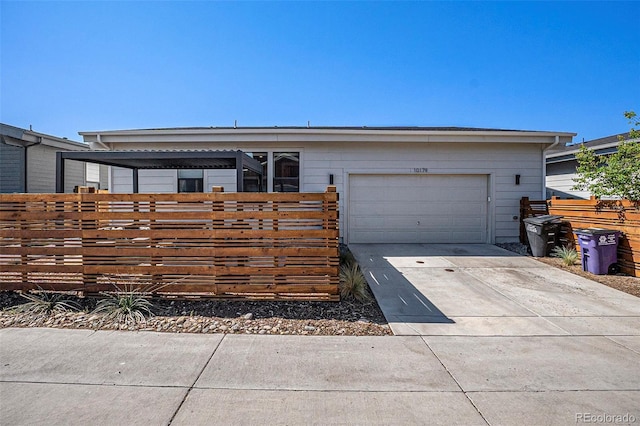 10179 E 59th N Pl, Denver, CO 80238 - ranch-style house with concrete driveway and a garage