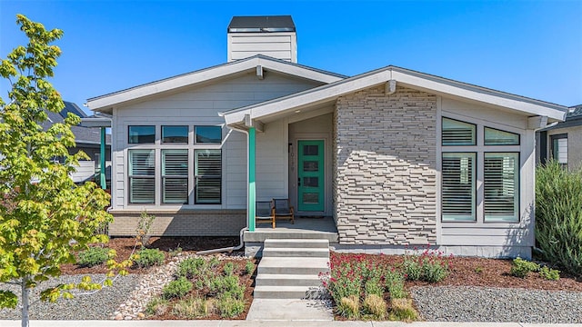 10179 E 59th N Pl, Denver, CO 80238 - view of front facade featuring a chimney