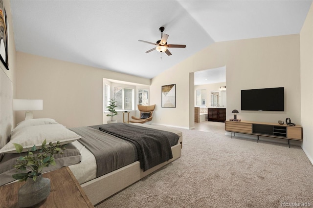 carpeted bedroom with ensuite bathroom, baseboards, ceiling fan, and lofted ceiling