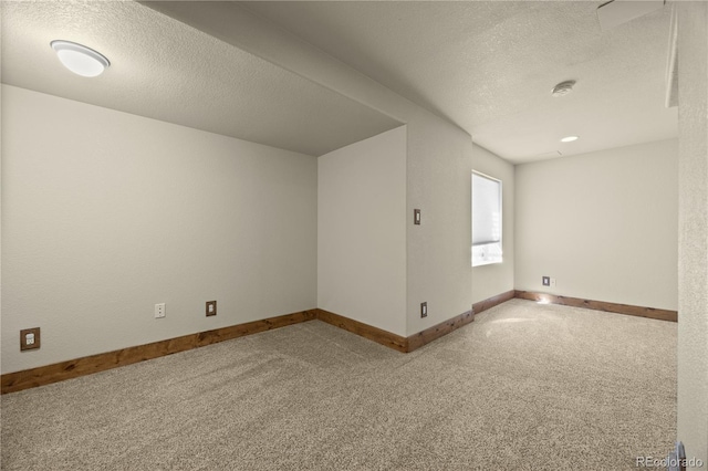 interior space with baseboards and a textured ceiling