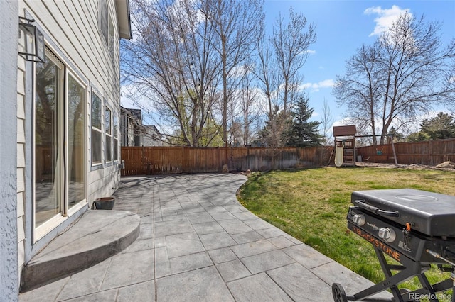 view of patio / terrace featuring a fenced backyard and a playground