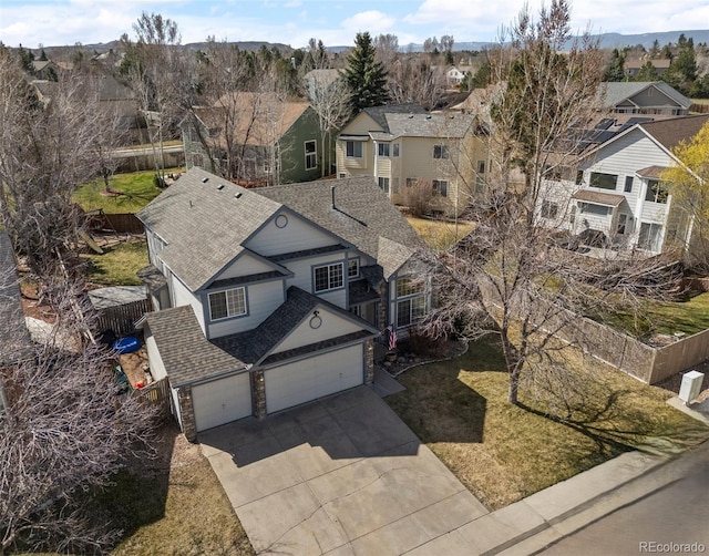 birds eye view of property with a residential view