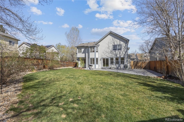 back of house featuring a patio, a fenced backyard, and a yard