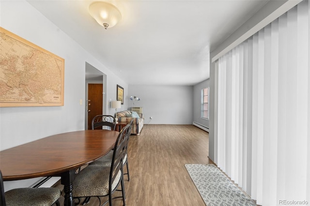 1625 W Elizabeth St Unit G2, Fort Collins, CO 80521 - dining space with a baseboard radiator and wood finished floors