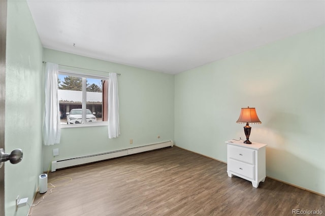 1625 W Elizabeth St Unit G2, Fort Collins, CO 80521 - unfurnished room with baseboard heating and wood finished floors