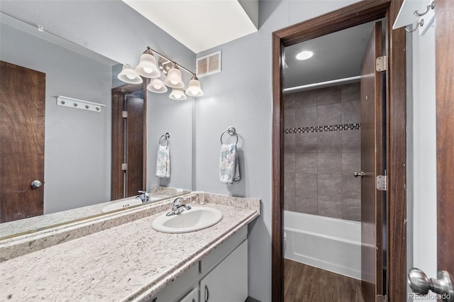 1625 W Elizabeth St Unit G2, Fort Collins, CO 80521 - bathroom with vanity, wood finished floors, and  shower combination
