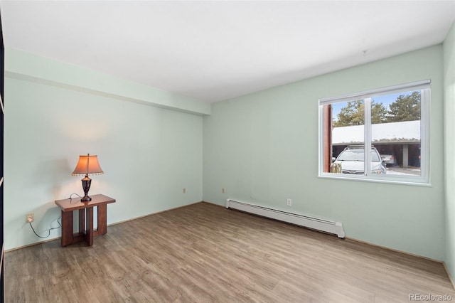 1625 W Elizabeth St Unit G2, Fort Collins, CO 80521 - spare room with a baseboard radiator and wood finished floors