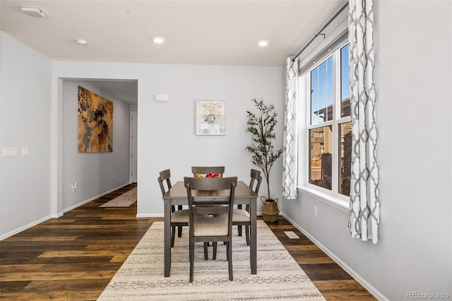 dining room featuring dark wood-style floors, recessed lighting, and baseboards