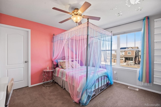 carpeted bedroom featuring visible vents, ceiling fan, and baseboards