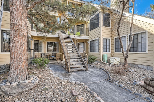 view of front of home featuring a patio area and stairs