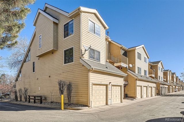 view of property exterior with a residential view