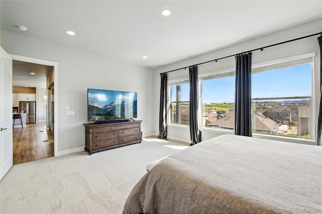18212 W 95th Pl, Arvada, CO 80007 - carpeted bedroom with baseboards, stainless steel fridge, and recessed lighting