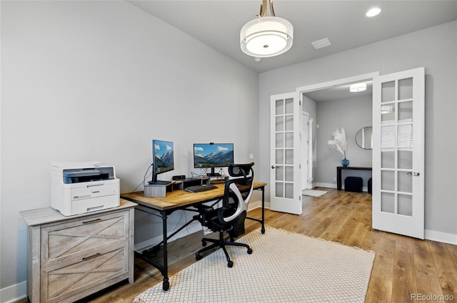 18212 W 95th Pl, Arvada, CO 80007 - home office featuring french doors, light wood-style flooring, and baseboards