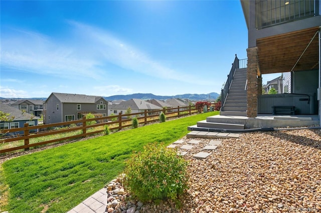 18212 W 95th Pl, Arvada, CO 80007 - view of yard featuring a residential view, stairs, and a mountain view