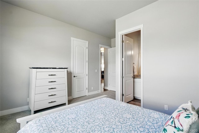 18212 W 95th Pl, Arvada, CO 80007 - carpeted bedroom featuring baseboards and ensuite bathroom
